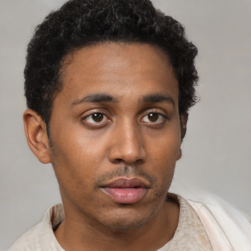 Neutral latino young-adult male with short  brown hair and brown eyes
