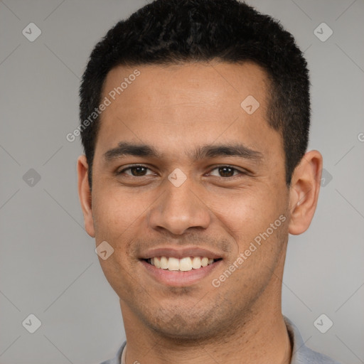 Joyful white young-adult male with short  black hair and brown eyes