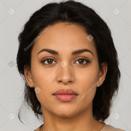 Joyful latino young-adult female with medium  brown hair and brown eyes