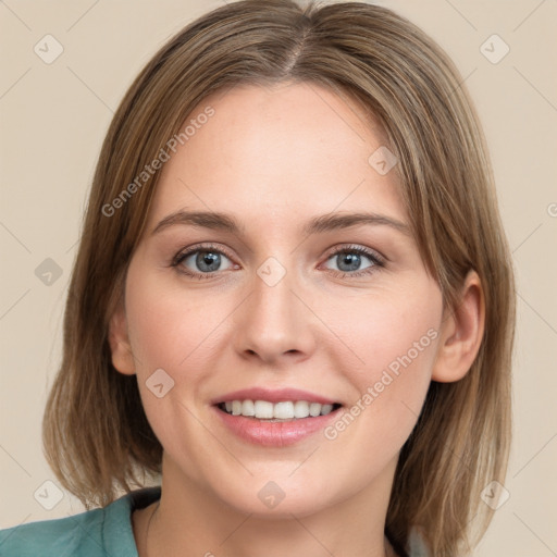 Joyful white young-adult female with medium  brown hair and green eyes