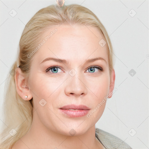 Joyful white young-adult female with long  brown hair and blue eyes