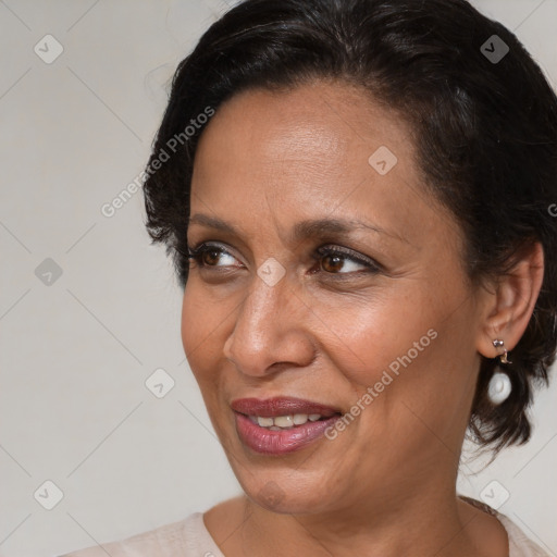 Joyful black adult female with medium  brown hair and brown eyes