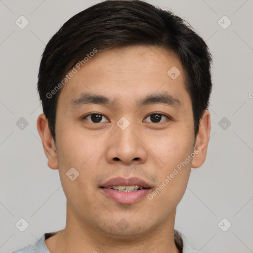 Joyful asian young-adult male with short  brown hair and brown eyes