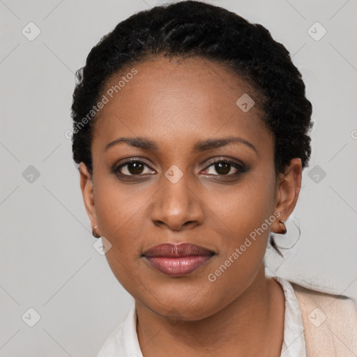 Joyful black young-adult female with short  black hair and brown eyes