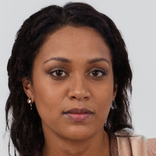 Neutral black young-adult female with long  brown hair and brown eyes