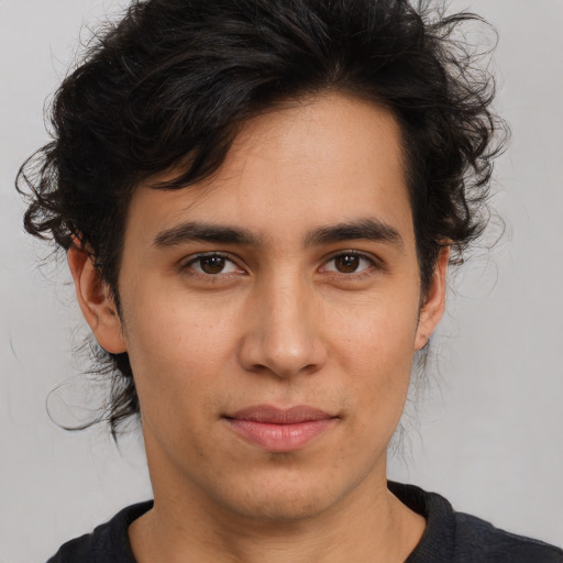 Joyful white young-adult male with medium  brown hair and brown eyes