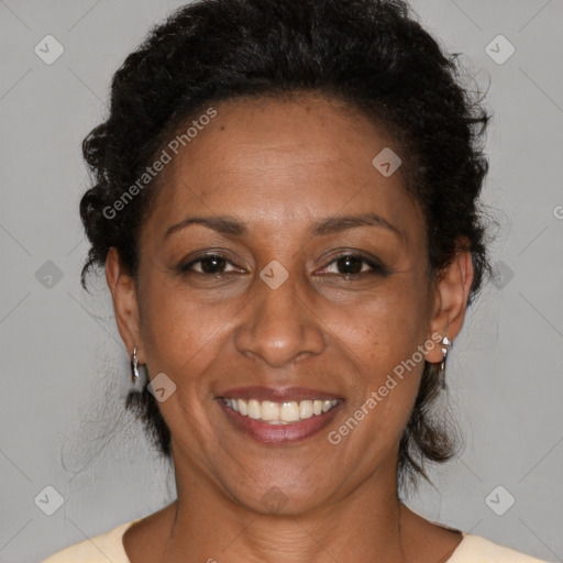 Joyful black adult female with medium  brown hair and brown eyes