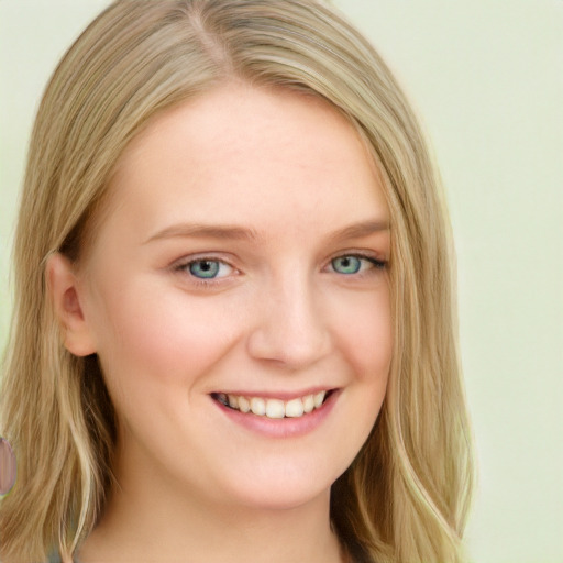 Joyful white young-adult female with long  blond hair and blue eyes