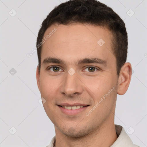 Joyful white young-adult male with short  brown hair and brown eyes