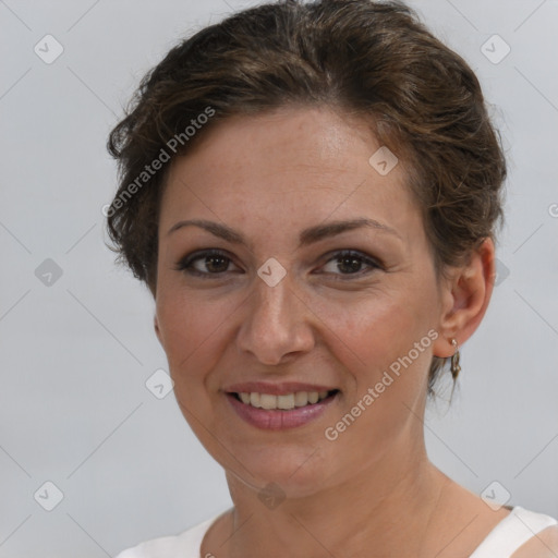 Joyful white adult female with short  brown hair and brown eyes