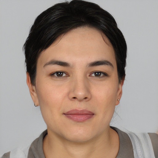 Joyful white young-adult female with short  black hair and brown eyes