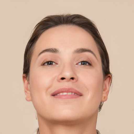 Joyful white young-adult female with short  brown hair and brown eyes