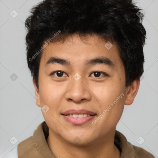 Joyful asian young-adult male with short  brown hair and brown eyes