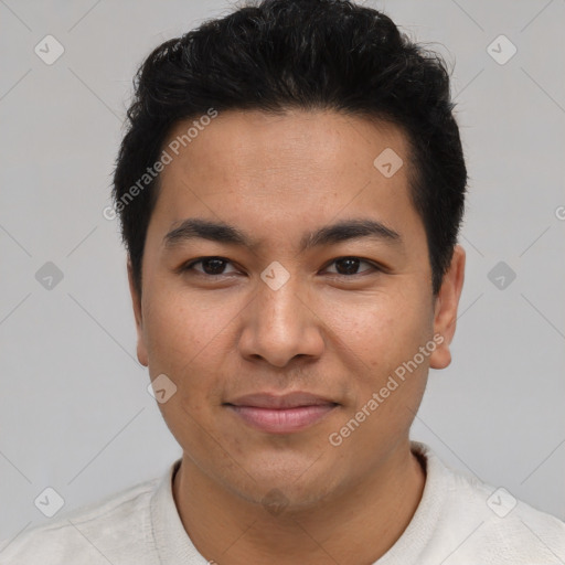 Joyful latino young-adult male with short  brown hair and brown eyes