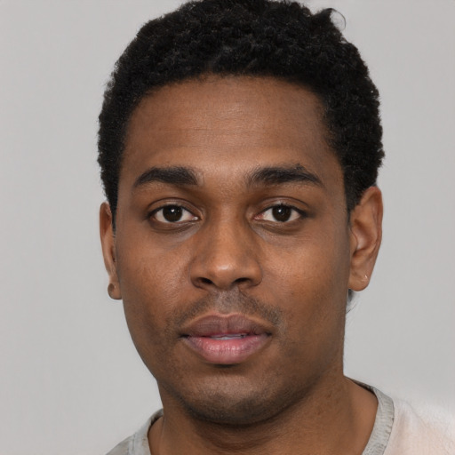 Neutral black young-adult male with short  black hair and brown eyes