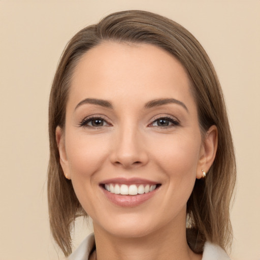 Joyful white young-adult female with long  brown hair and brown eyes