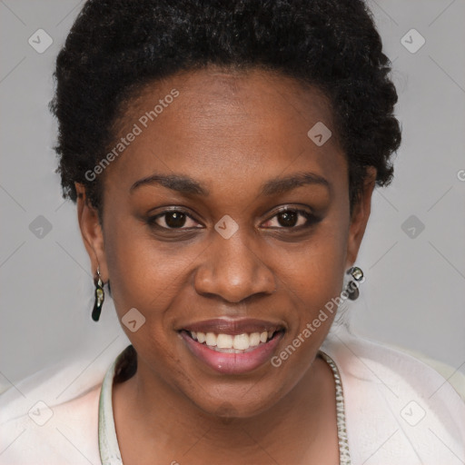 Joyful black young-adult female with short  brown hair and brown eyes