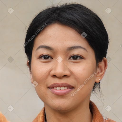 Joyful asian young-adult female with medium  black hair and brown eyes