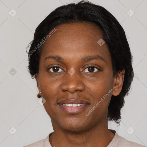 Joyful black young-adult female with short  black hair and brown eyes