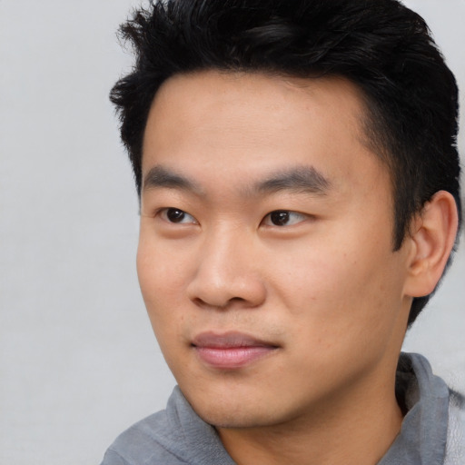 Neutral asian young-adult male with short  black hair and brown eyes
