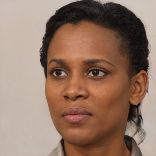 Neutral black young-adult female with medium  black hair and brown eyes