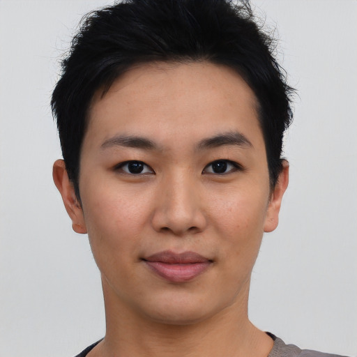 Joyful asian young-adult female with short  black hair and brown eyes
