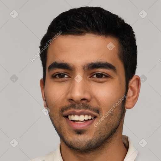 Joyful latino young-adult male with short  black hair and brown eyes