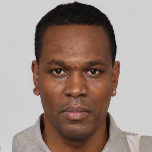 Neutral black young-adult male with short  black hair and brown eyes
