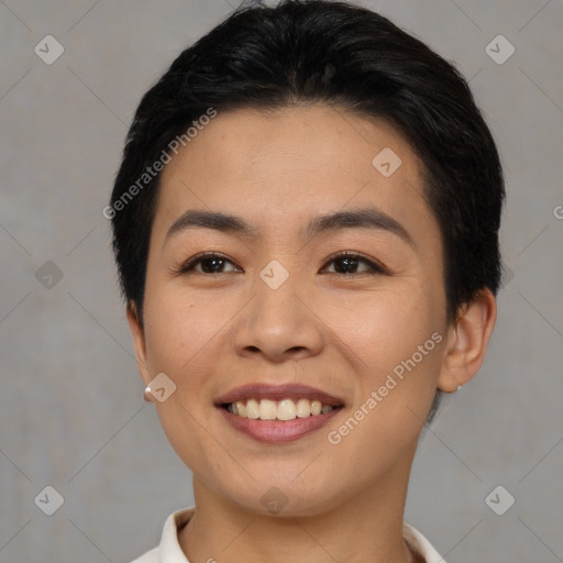 Joyful asian young-adult female with short  black hair and brown eyes