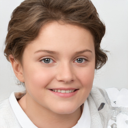 Joyful white child female with short  brown hair and brown eyes