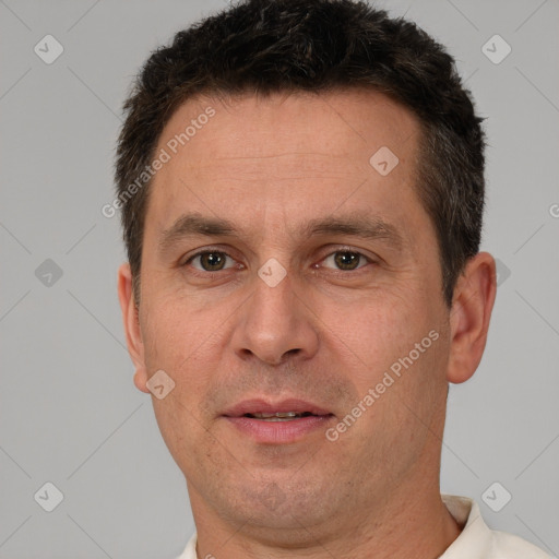 Joyful white adult male with short  brown hair and brown eyes