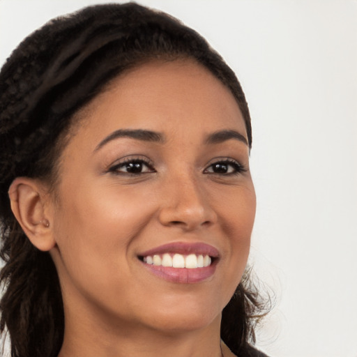 Joyful latino young-adult female with long  brown hair and brown eyes