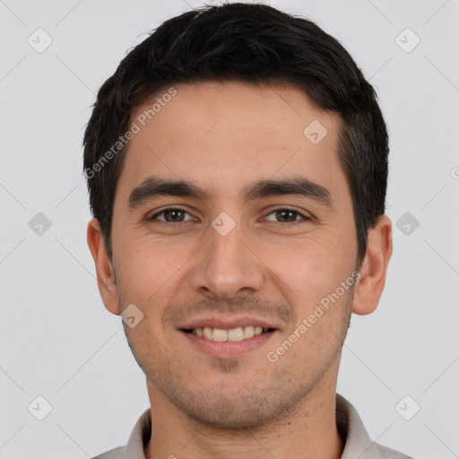 Joyful white young-adult male with short  black hair and brown eyes