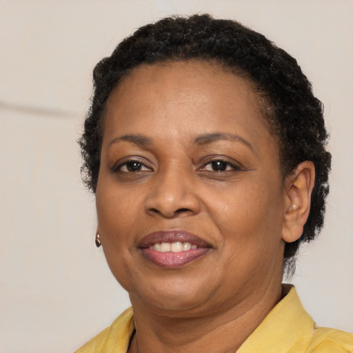 Joyful latino adult female with short  brown hair and brown eyes