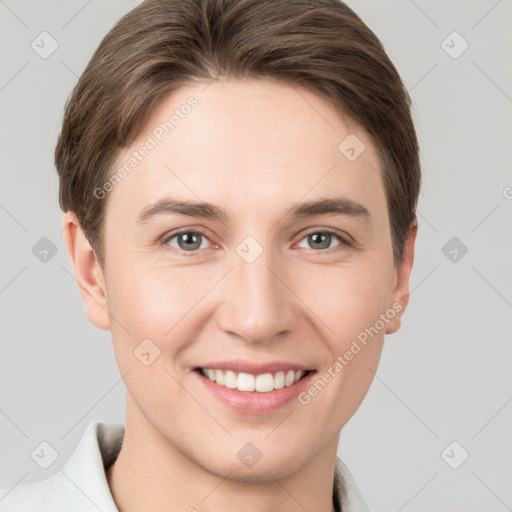 Joyful white young-adult female with short  brown hair and grey eyes