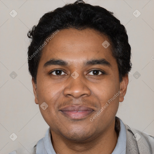 Joyful black young-adult male with short  black hair and brown eyes