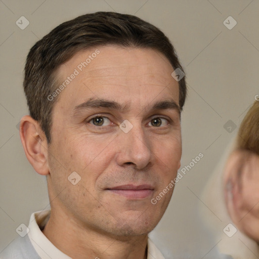 Joyful white adult male with short  brown hair and brown eyes