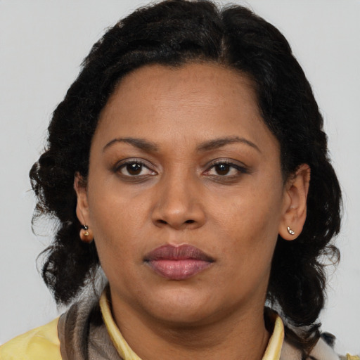 Neutral latino adult female with medium  brown hair and brown eyes