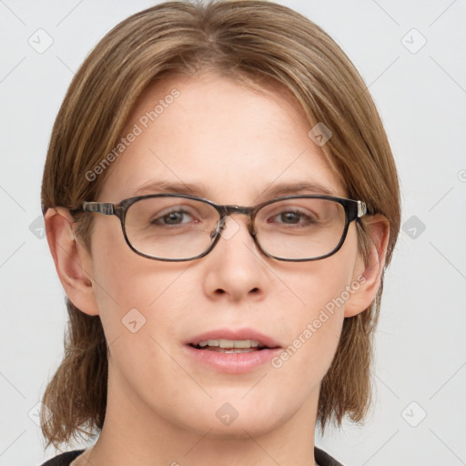 Joyful white young-adult female with medium  brown hair and blue eyes