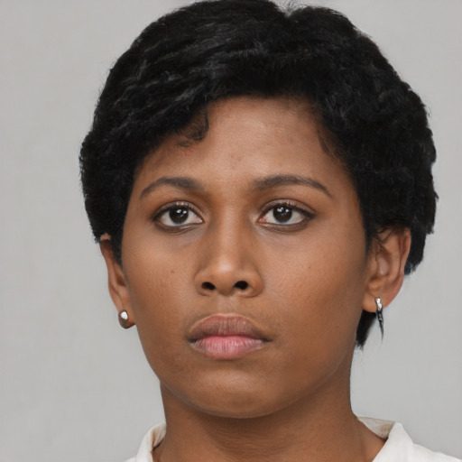 Neutral black young-adult female with short  black hair and brown eyes