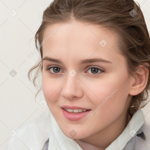 Joyful white child female with medium  brown hair and brown eyes