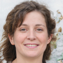 Joyful white adult female with medium  brown hair and grey eyes