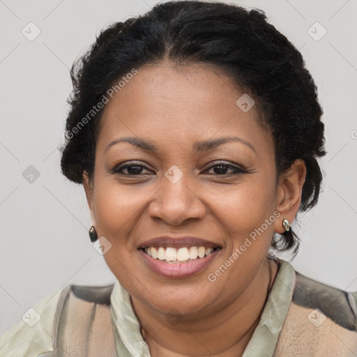 Joyful latino adult female with short  brown hair and brown eyes