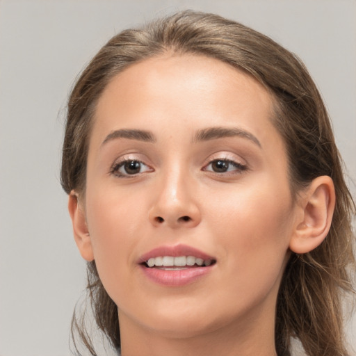 Joyful white young-adult female with medium  brown hair and brown eyes