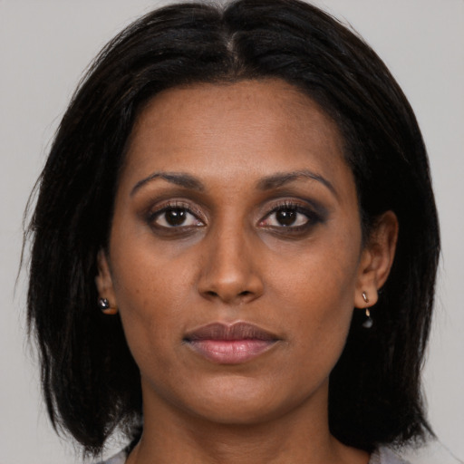 Neutral asian young-adult female with medium  brown hair and brown eyes