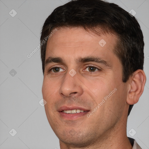 Joyful white young-adult male with short  brown hair and brown eyes