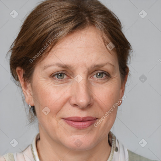 Joyful white adult female with medium  brown hair and blue eyes