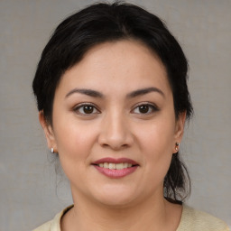 Joyful white young-adult female with medium  brown hair and brown eyes