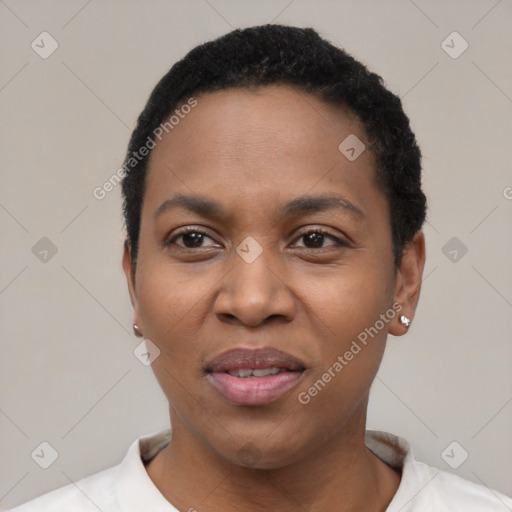 Joyful black young-adult female with short  black hair and brown eyes