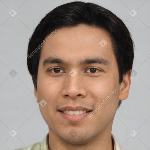 Joyful asian young-adult male with short  brown hair and brown eyes